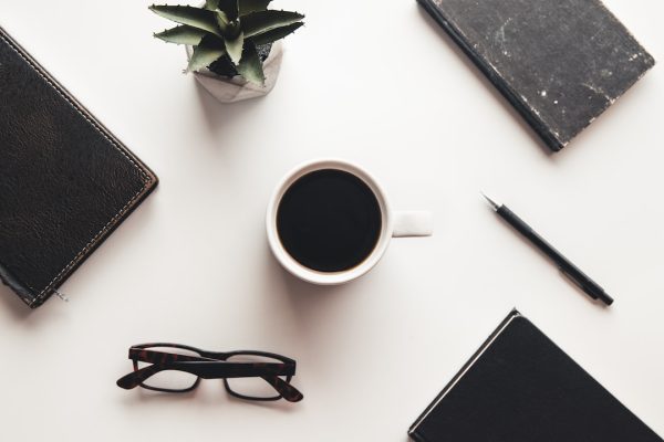 office-desk-table-with-supplies-coffee-cup-and-fl-2024-12-04-17-24-29-utc